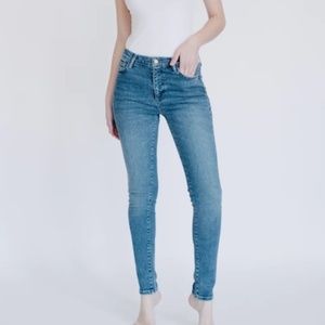 Triarchy  Plastic-Free Stretch Skinny Jean in Medium Indigo and size 28